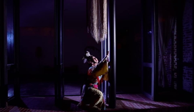 Yuji looks at the lowered scarf in The House Behind the WallPhoto TFAM